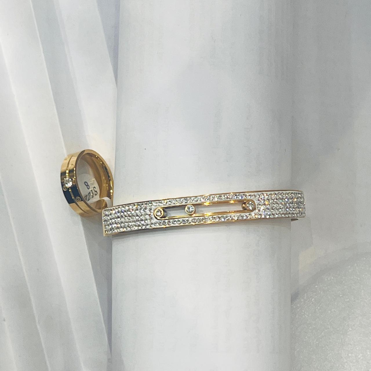 سوار وخاتم بلون ذهبي مزيّن بكريستال لامع وثبات يدوم